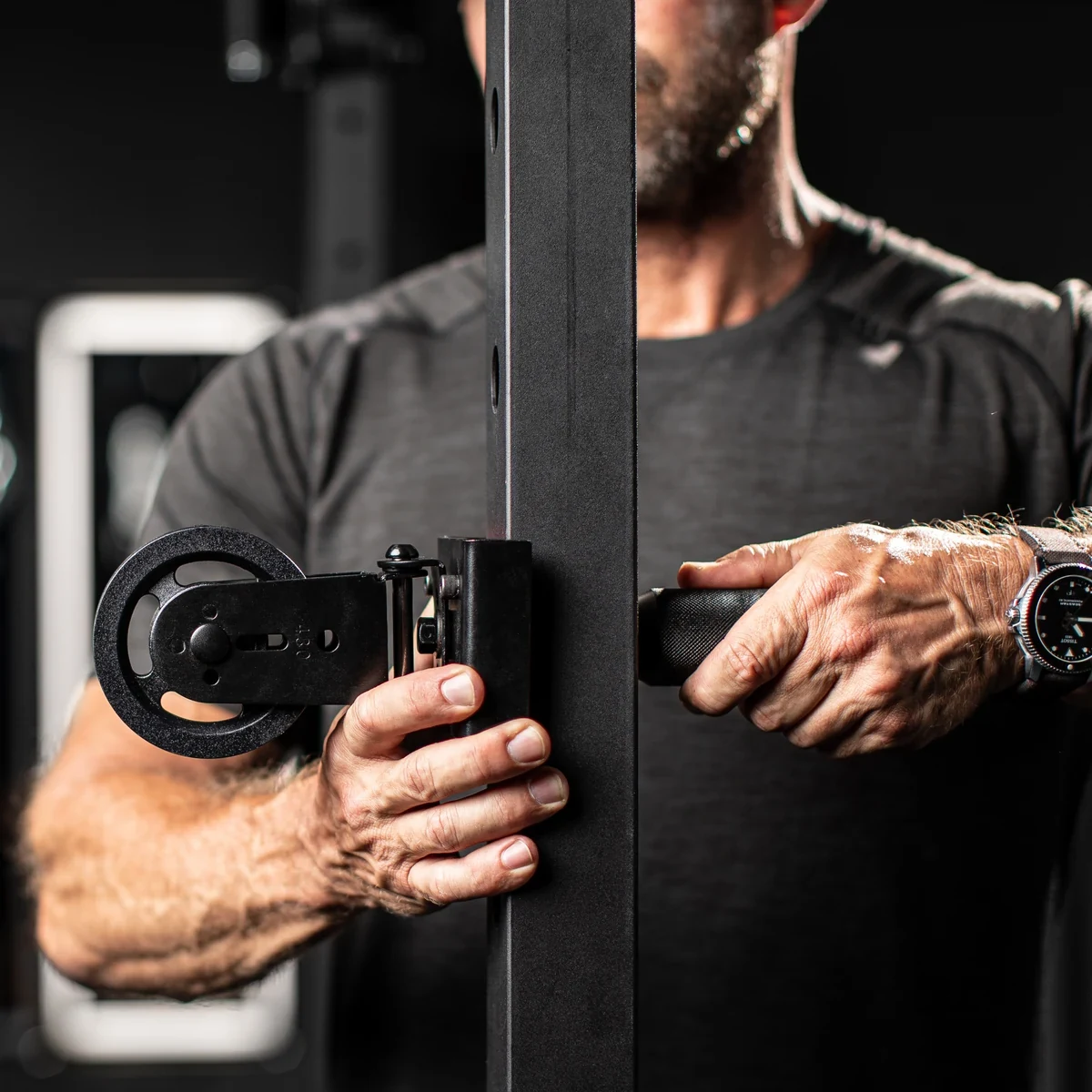 Bullet Pulley, raw: a man fitting the pulley to a rack, as the photo came